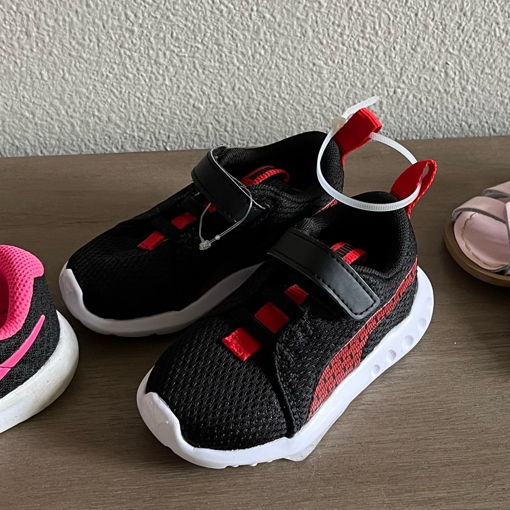 Black and red puma shoes